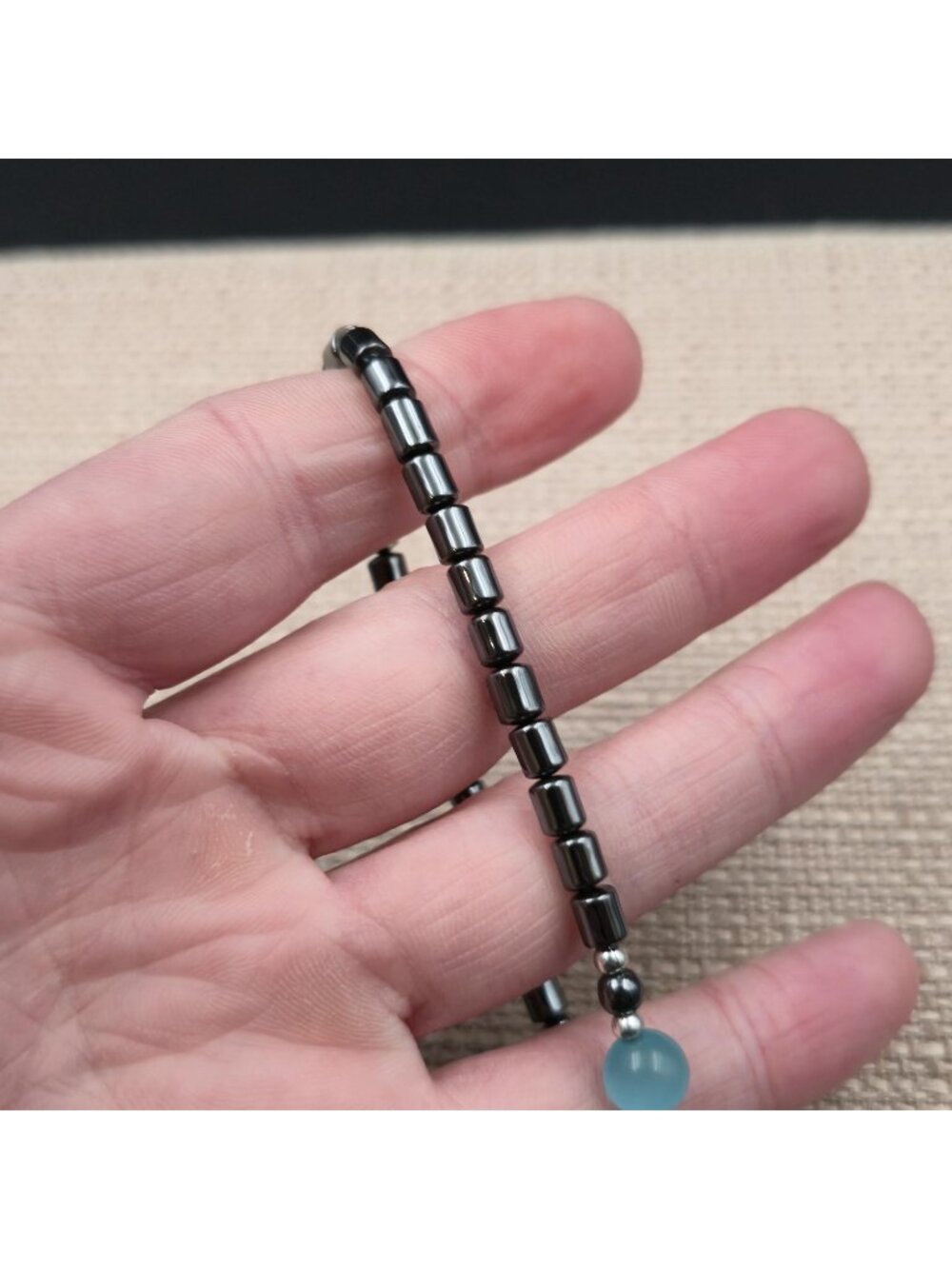 7 Inch Hematite Cylinder Bracelet with Light Blue Cat's Eye Focal Bead Bracelet - Picture 3 of 6